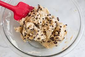 Folding chocolate chips into cookie dough