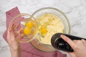 Adding egg and vanilla to the butter mixture